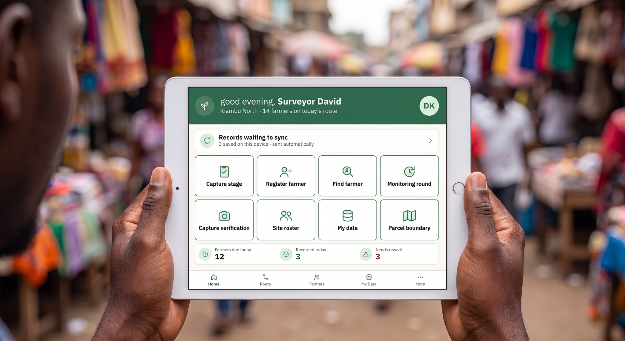 A surveyor holding a tablet that shows the Carbon Field home screen, in a market street